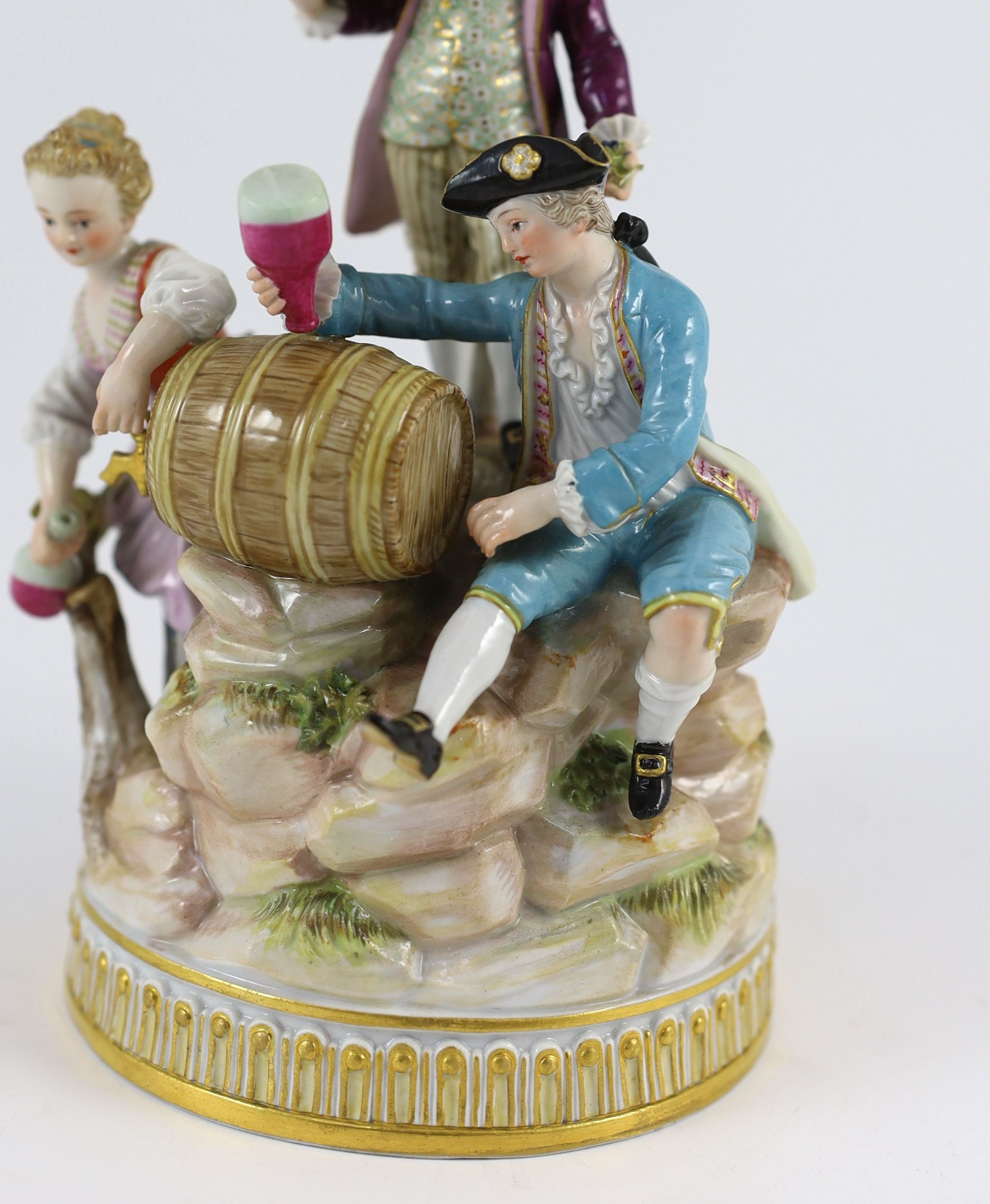 A Meissen group of the three winemakers, 19th century, after a model by Michel Victor Acier, 21 cm high